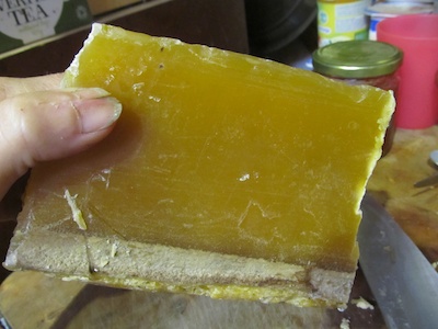 A slab of natural beeswax before melting