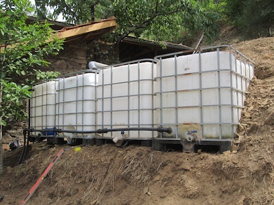 All 4 tanks in position, levelled, and connected via a 40mm pipe running along the bottom
