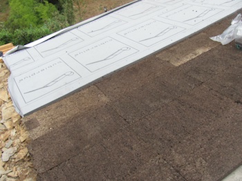 Cork insulation and breathable membrane go on to the roof