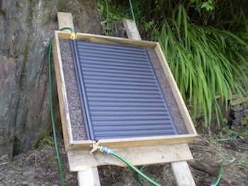 Solar water heating - radiator mounted in box