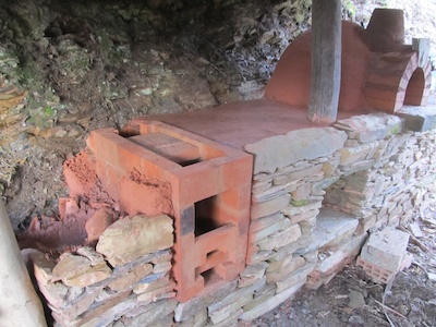 Wood-burning masonry cookstove for an outdoor kitchen
