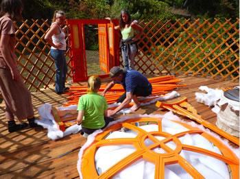Aonghas and Andy unpacking the crown wheel supports. Helen, Sophie and Cynthia look on